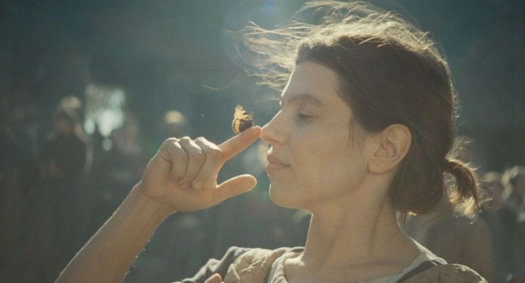 Woman with a butterfly on her finger